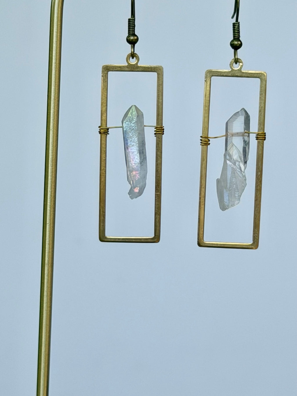 Close-up of bronze rectangular Angel Aura crystal earrings