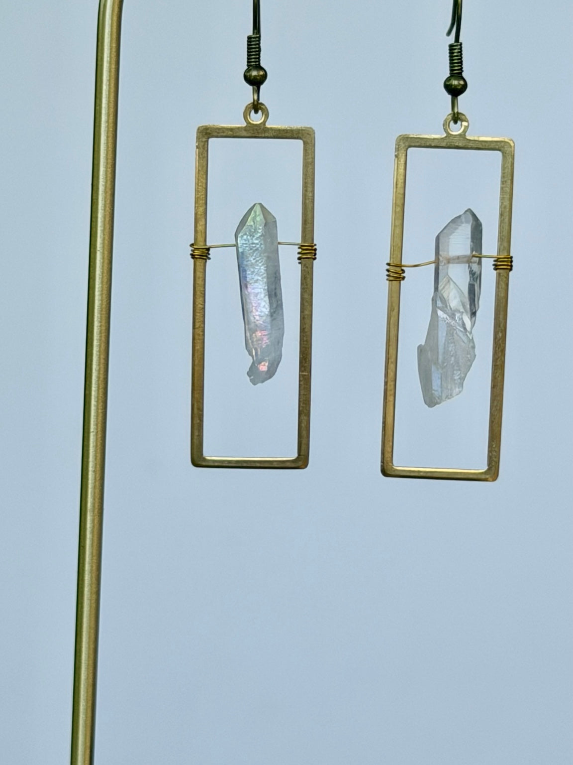 Close-up of bronze rectangular Angel Aura crystal earrings