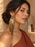 Latina model in a rust-colored top wearing a Desert Sky Feather Hoop Earring