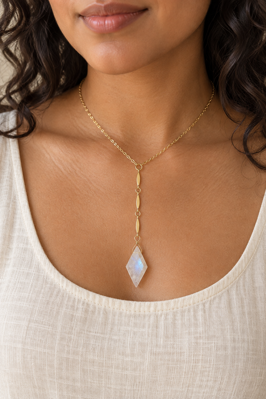 Latina model wearing the 14K gold-filled Goddess Light Rainbow Moonstone Y Necklace