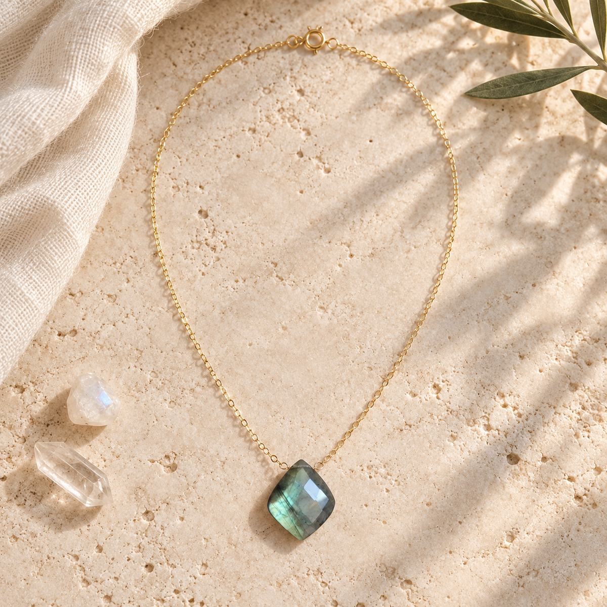 14K gold-filled Labradorite Petal Necklace flat lay with moonstone and clear quartz