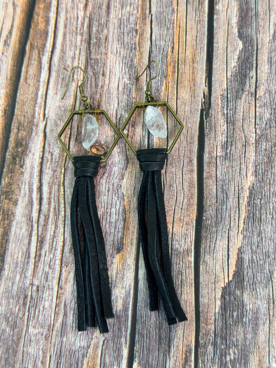 Natural clear quartz points suspended in bronze hexagon earrings