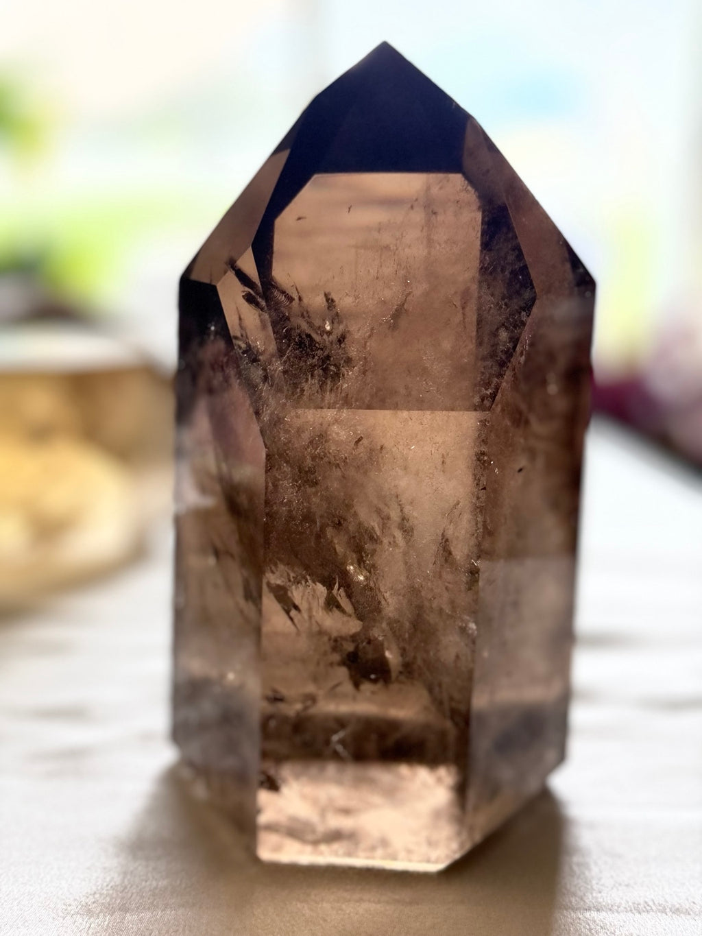 High-clarity Smoky Quartz tower in natural light